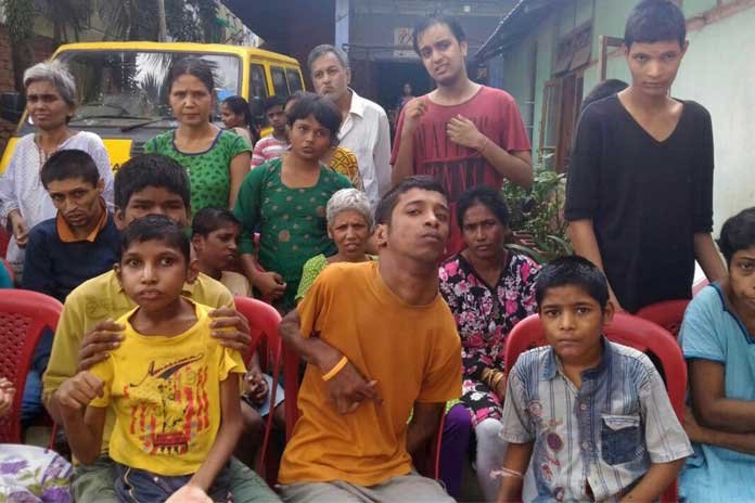 The physically handicapped students of Destination huddles up before guests